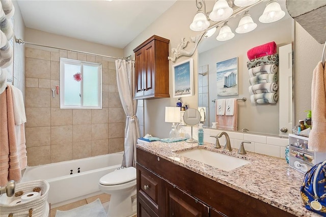 full bath with shower / tub combo, vanity, and toilet