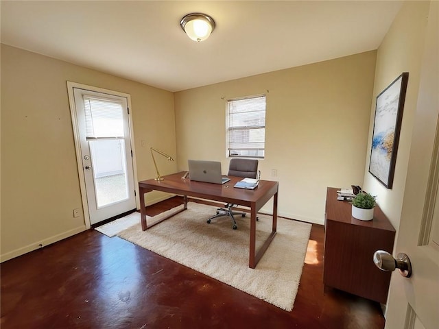 office space with wood finished floors and baseboards