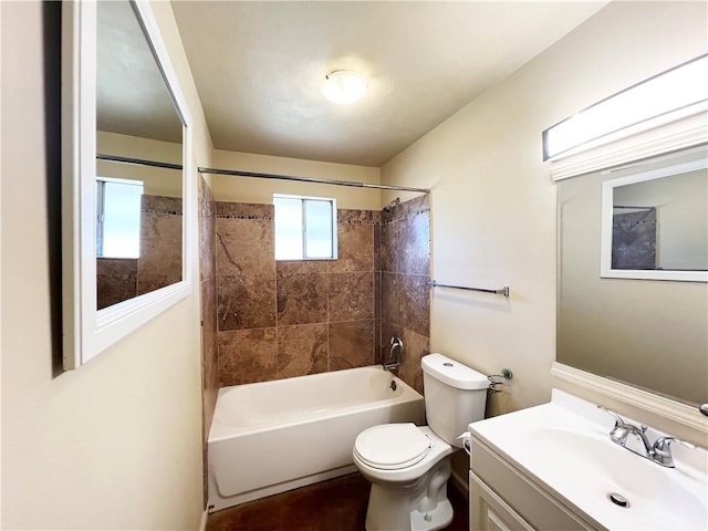 bathroom featuring tub / shower combination, vanity, and toilet