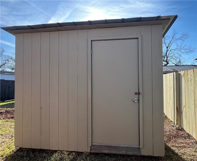 view of shed with fence