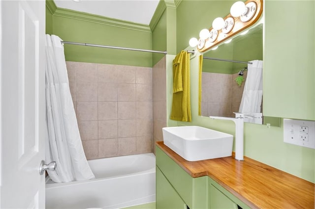 bathroom featuring ornamental molding, vanity, and shower / bath combo with shower curtain