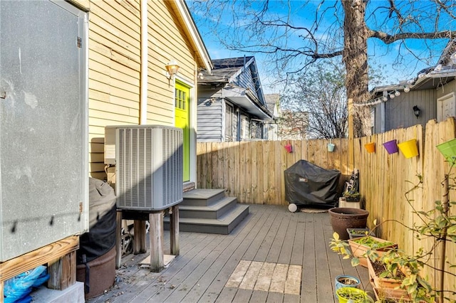 deck with fence and central AC unit