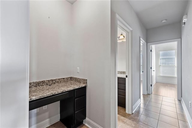 bathroom featuring tile patterned flooring and baseboards