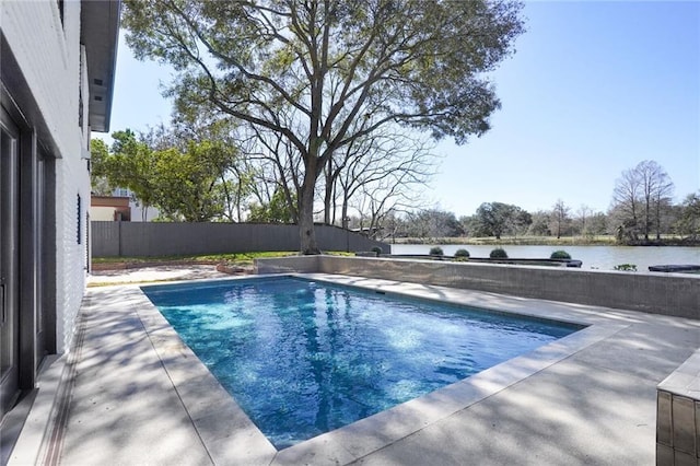 view of pool with a fenced in pool, a patio area, a water view, and fence