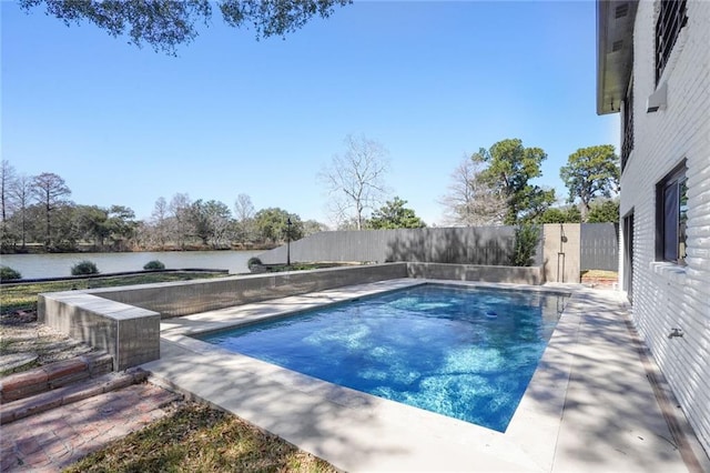 view of pool with a fenced in pool, a fenced backyard, and a water view