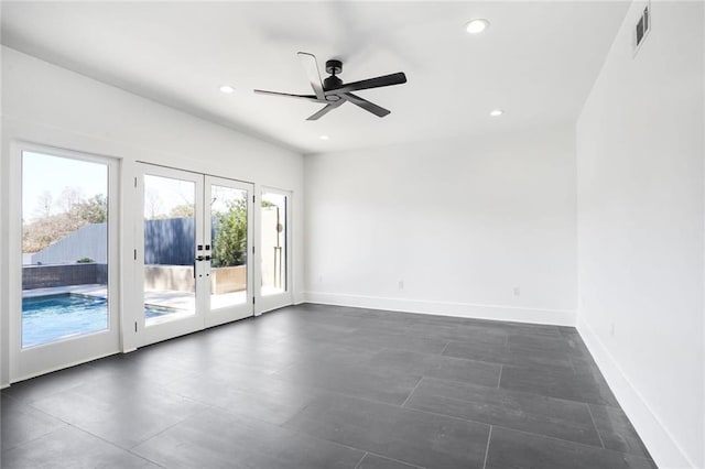 spare room with recessed lighting, french doors, visible vents, and baseboards