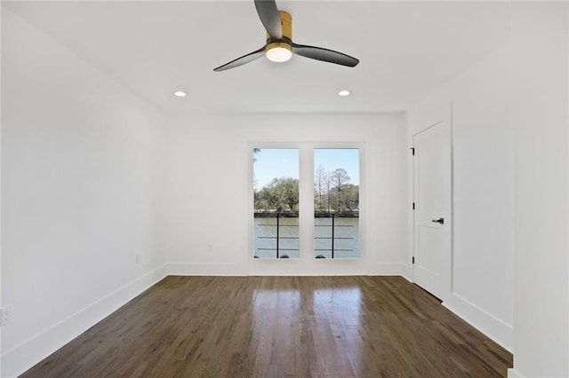 unfurnished room with a ceiling fan, baseboards, wood finished floors, and recessed lighting