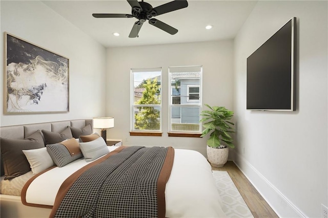 bedroom featuring recessed lighting, ceiling fan, baseboards, and wood finished floors