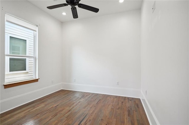 spare room featuring ceiling fan, baseboards, dark wood-type flooring, and recessed lighting