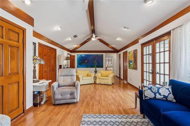 living area with lofted ceiling with beams, french doors, visible vents, and light wood-style floors