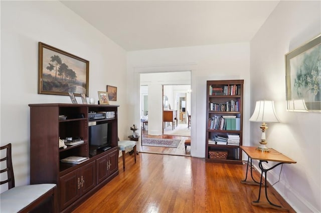 sitting room featuring wood finished floors and baseboards