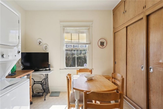 dining room with baseboards and light floors