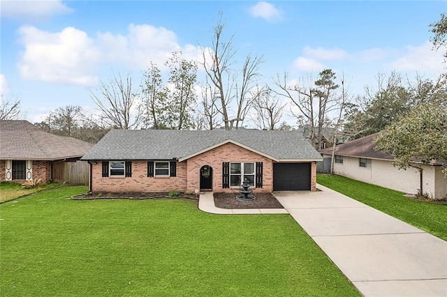 single story home with a garage, concrete driveway, roof with shingles, a front yard, and brick siding