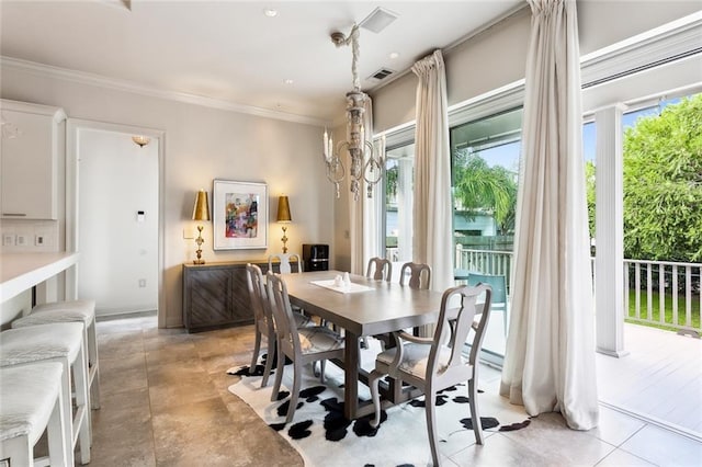 dining room featuring crown molding, light tile patterned flooring, visible vents, and a chandelier