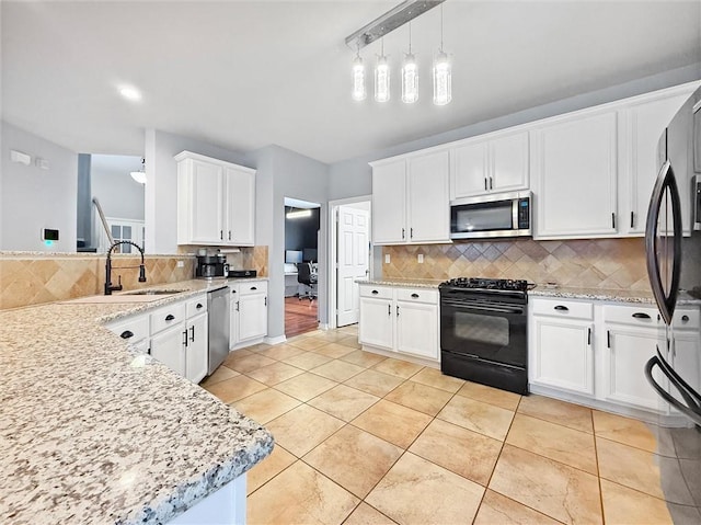 kitchen with light tile patterned floors, tasteful backsplash, white cabinetry, a sink, and black appliances