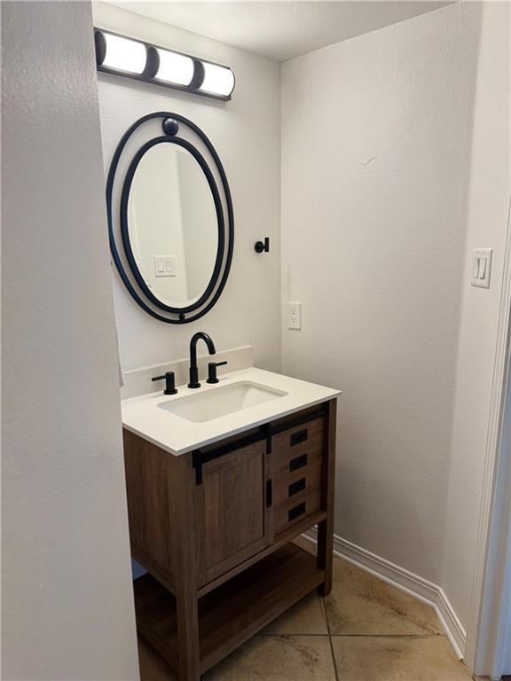 533 Moore Blvd, Covington, LA 70433 - bathroom with vanity and tile patterned floors