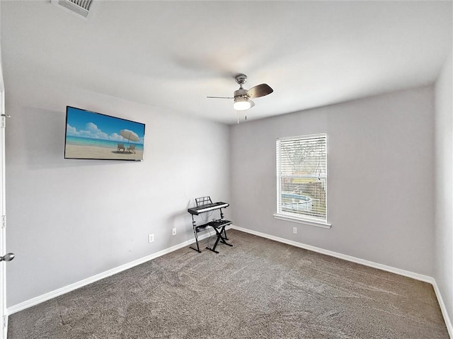 interior space with ceiling fan, visible vents, and baseboards