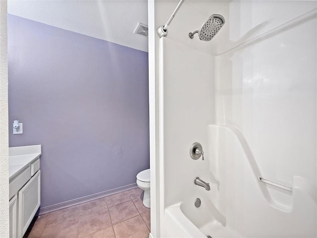 full bathroom featuring toilet, vanity, visible vents, tub / shower combination, and tile patterned floors