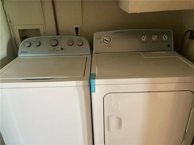 washroom featuring washer and dryer and laundry area