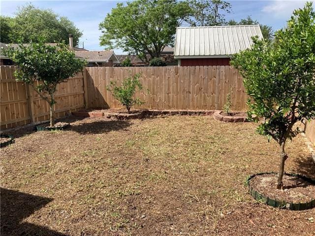 view of yard with a fenced backyard