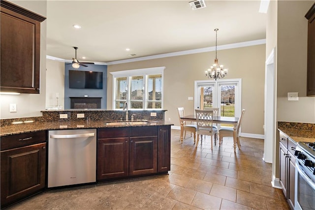 kitchen featuring visible vents, appliances with stainless steel finishes, crown molding, dark brown cabinets, and a sink