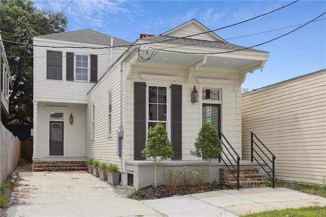3324 Camp St, New Orleans, LA 70115 - shotgun-style home with a shingled roof