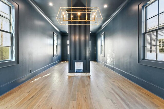 3324 Camp St, New Orleans, LA 70115 - unfurnished room featuring ornamental molding, a chandelier, wood finished floors, and recessed lighting