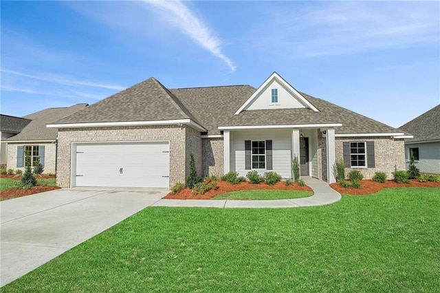 craftsman-style home with driveway, roof with shingles, an attached garage, brick siding, and a front lawn