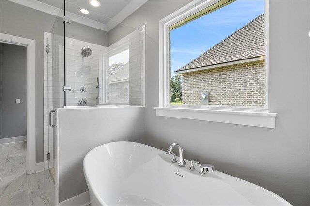 full bath featuring a stall shower, marble finish floor, a freestanding bath, and baseboards