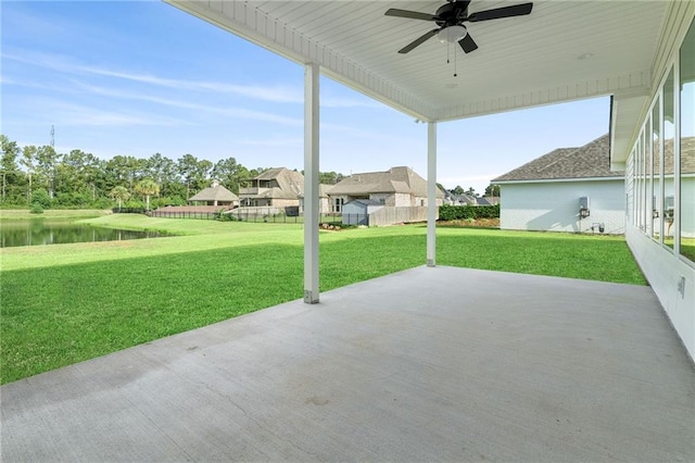 view of patio with a ceiling fan and fence