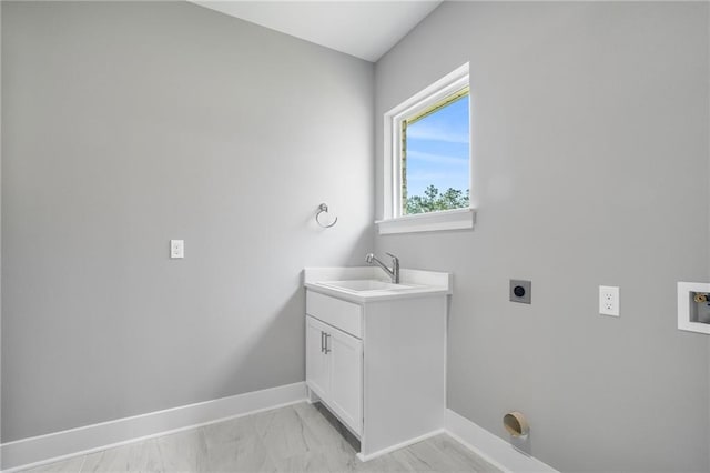 bathroom with vanity and baseboards
