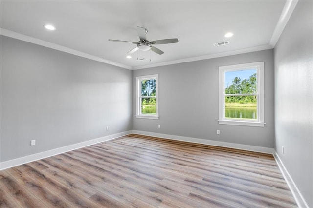 unfurnished room with baseboards and ornamental molding