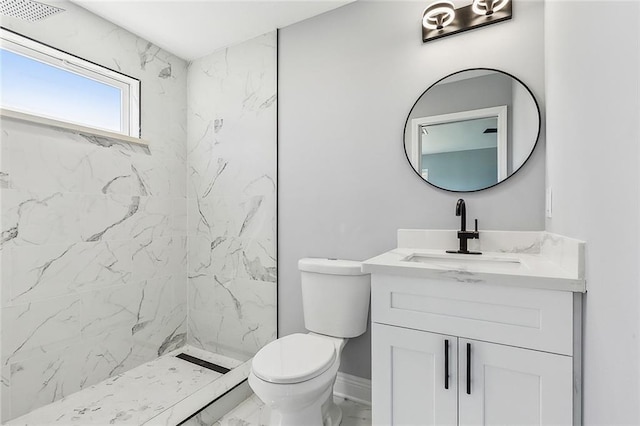 bathroom featuring toilet, visible vents, vanity, marble finish floor, and a shower stall