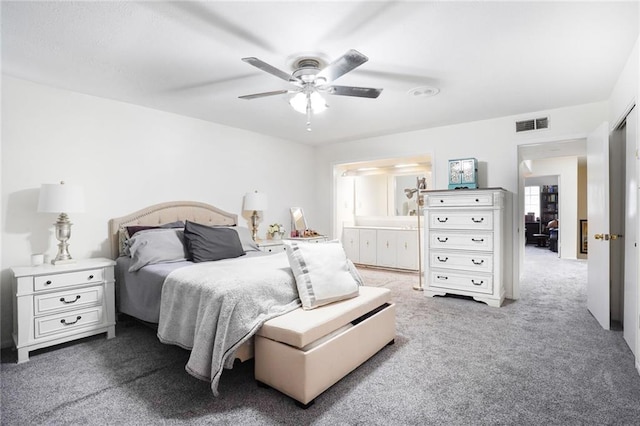 bedroom featuring ensuite bathroom, carpet, visible vents, and a ceiling fan