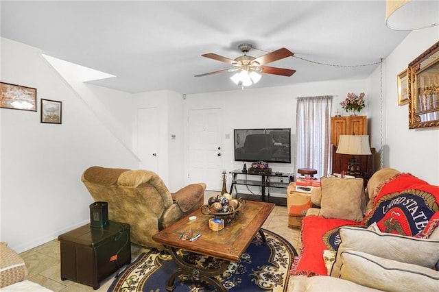 living room featuring ceiling fan and tile patterned flooring