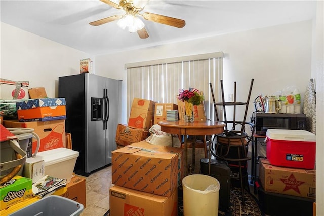 interior space featuring ceiling fan, tile patterned flooring, and stainless steel fridge with ice dispenser