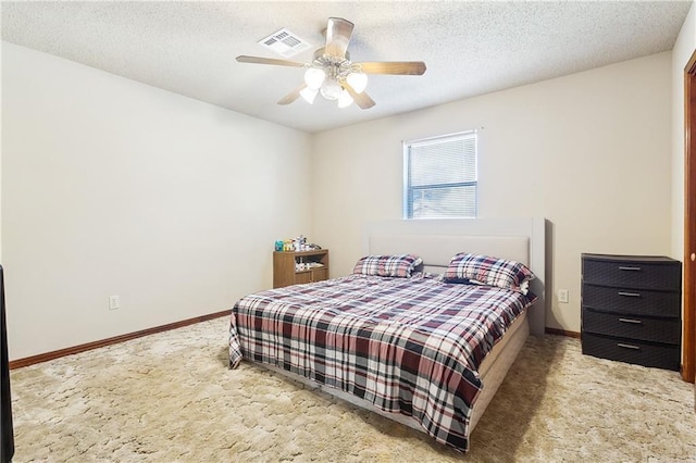 bedroom with baseboards, visible vents, ceiling fan, a textured ceiling, and carpet flooring