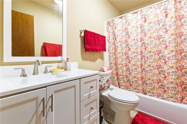 bathroom with shower / bath combo, vanity, and toilet