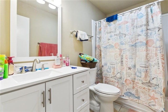 bathroom with vanity, tile patterned flooring, and toilet