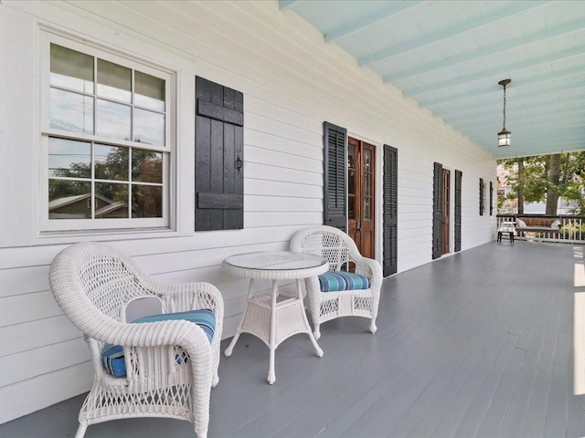 view of patio featuring a porch