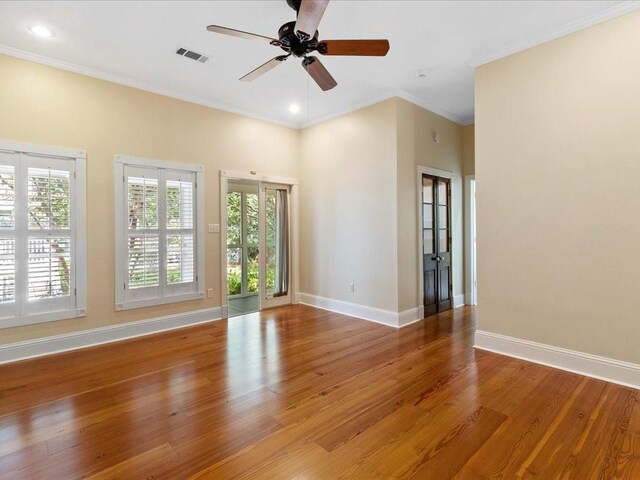 303 Lamarque St, Mandeville, LA 70448 - spare room featuring plenty of natural light, ceiling fan, wood finished floors, baseboards, and recessed lighting