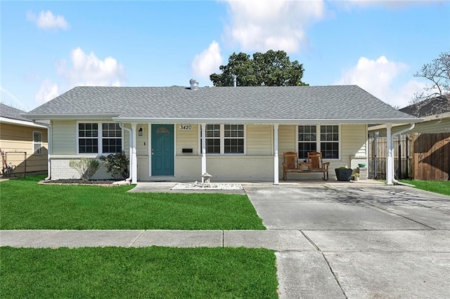 single story home with brick siding, a porch, a shingled roof, fence, and a front lawn