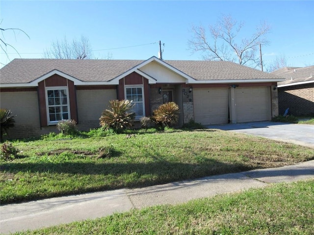 single story home with a garage, driveway, a shingled roof, a front yard, and brick siding