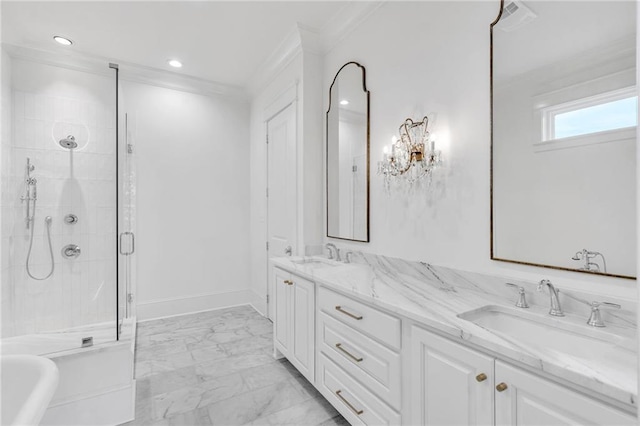 bathroom with marble finish floor, crown molding, a sink, and a stall shower