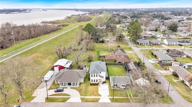 birds eye view of property featuring a residential view and a water view