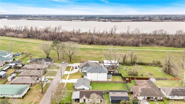 drone / aerial view with a water view and a residential view