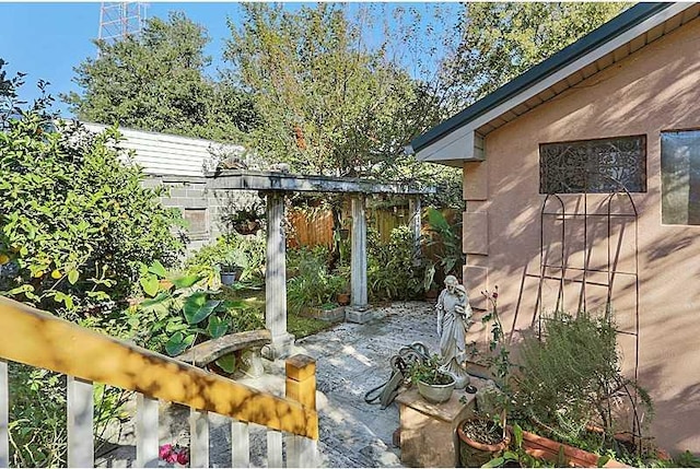 view of patio featuring fence