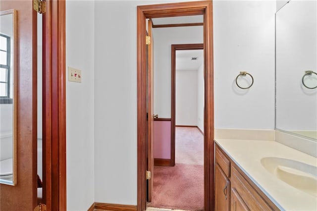 bathroom featuring vanity and baseboards