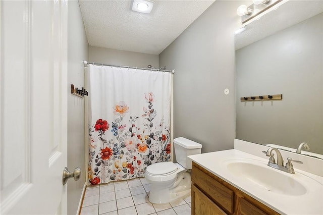 full bath with a textured ceiling, toilet, a shower with shower curtain, vanity, and tile patterned floors