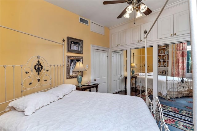 bedroom featuring ceiling fan, ornamental molding, and visible vents